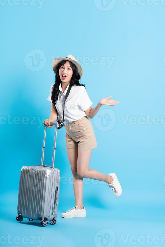 Portrait of beautiful asian girl traveling, isolated on white background photo