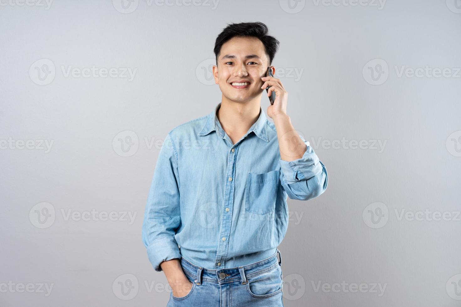 image of young businessman male on gray background photo