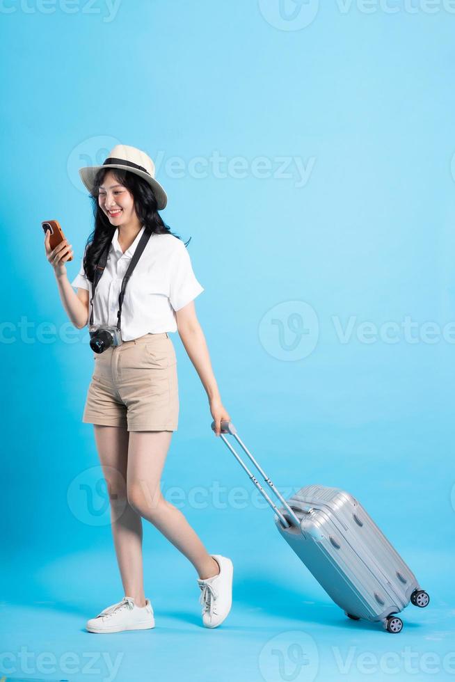 Portrait of beautiful asian girl traveling, isolated on white background photo