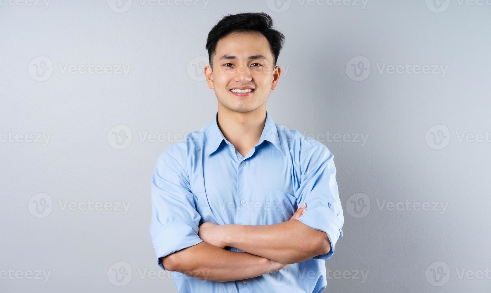 image of young businessman male on gray background photo