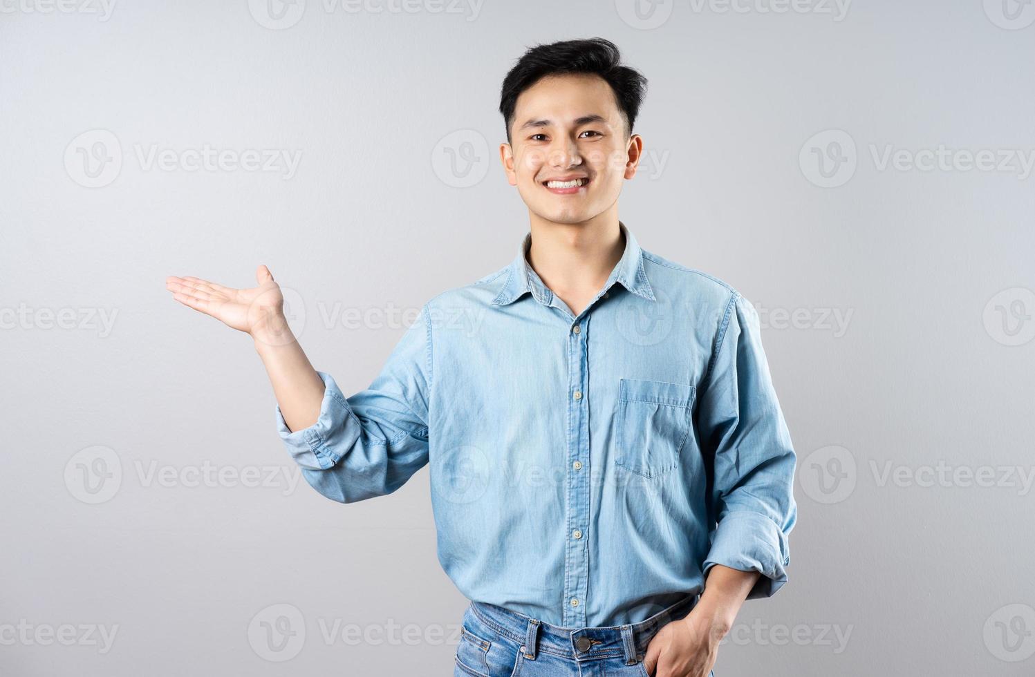 image of young businessman male on gray background photo