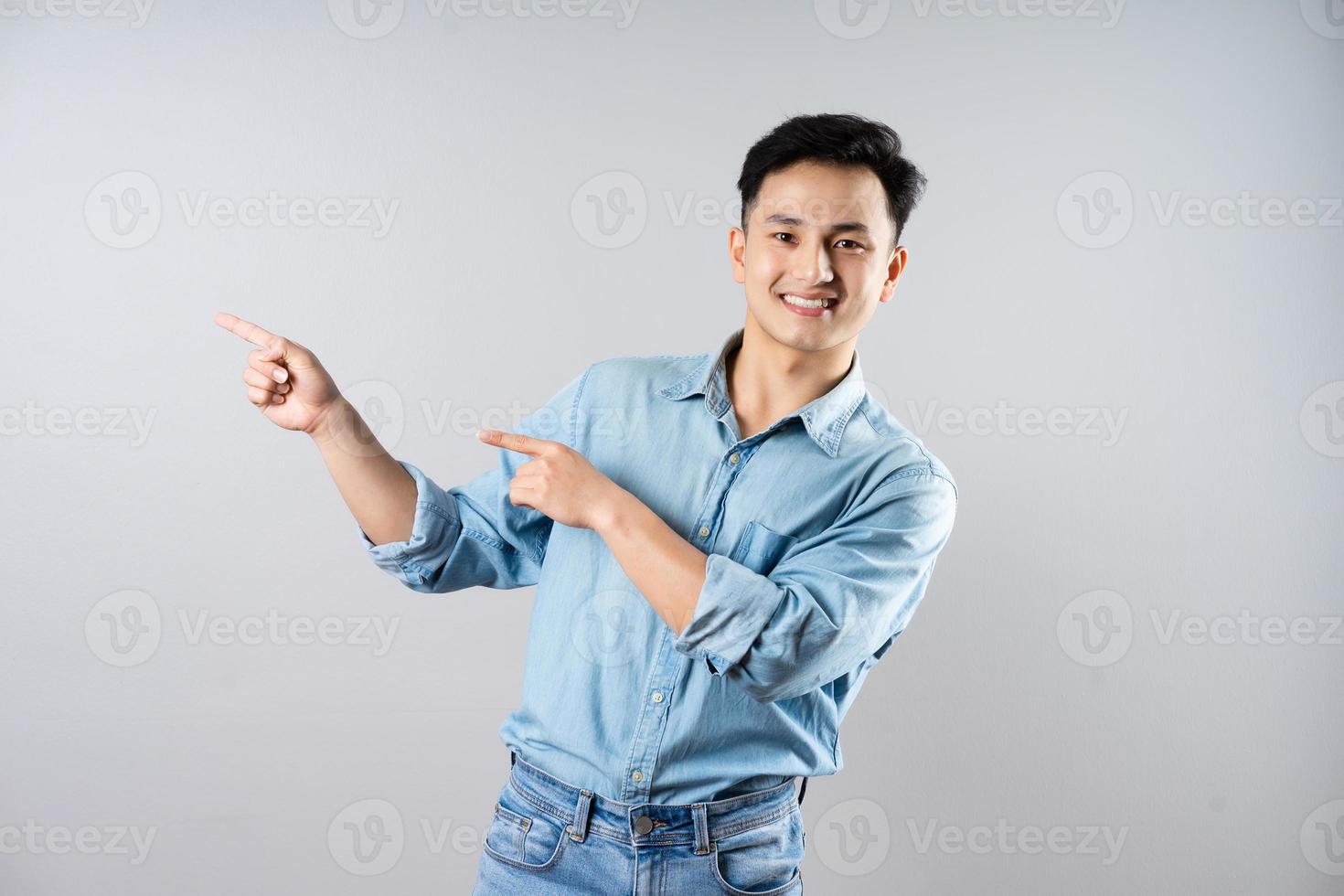 image of young businessman male on gray background photo