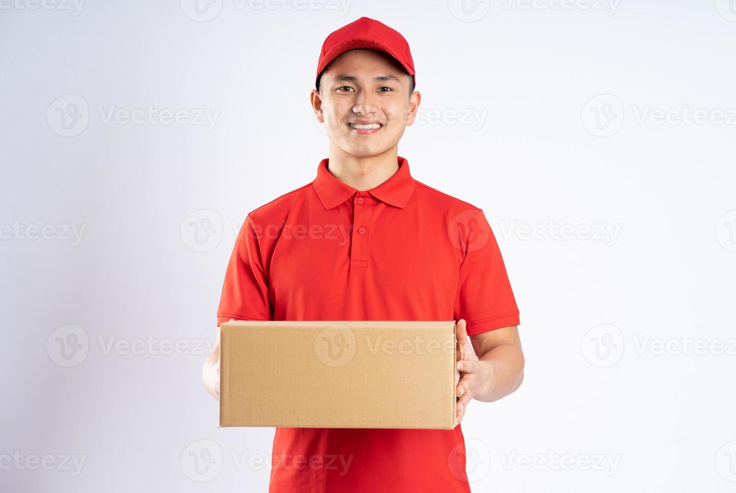 portrait of asian delivery man on white background photo