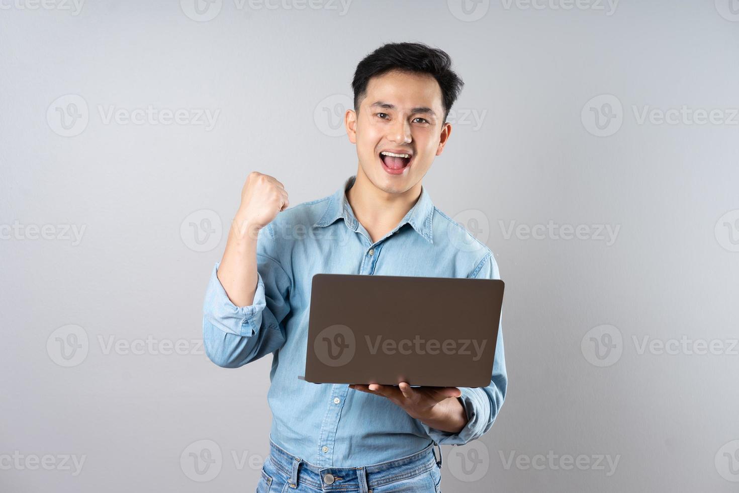 image of young businessman male on gray background photo