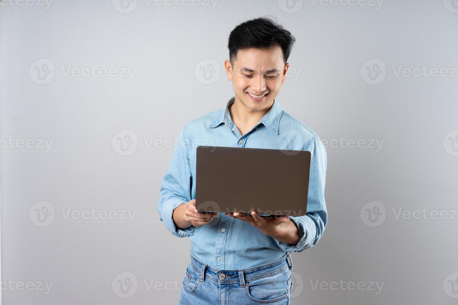 image of young businessman male on gray background photo