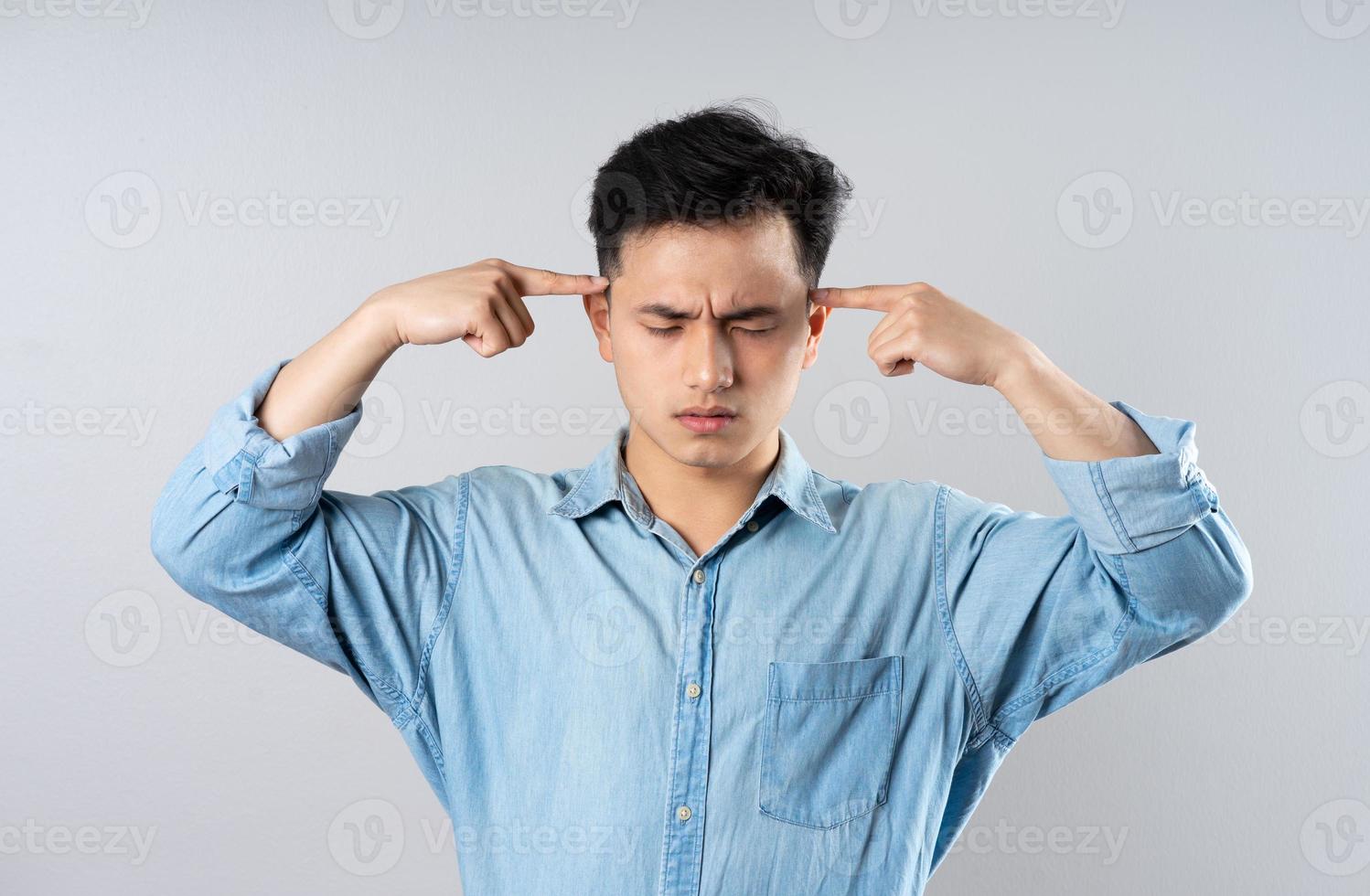 image of young businessman male on gray background photo