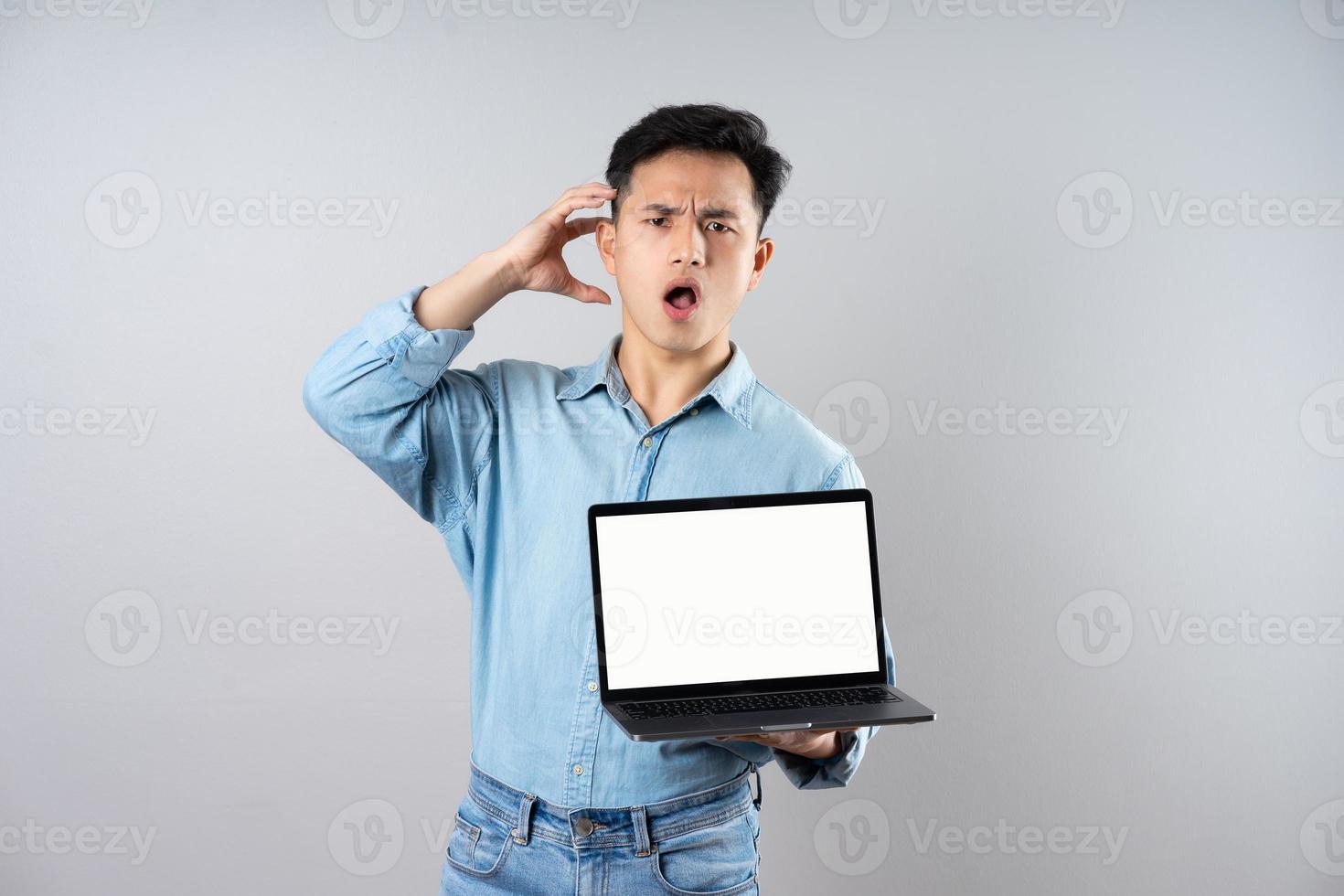 image of young businessman male on gray background photo