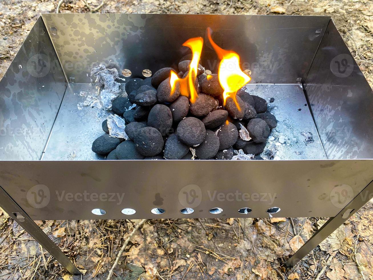 Brazier with burning coal briquettes. photo