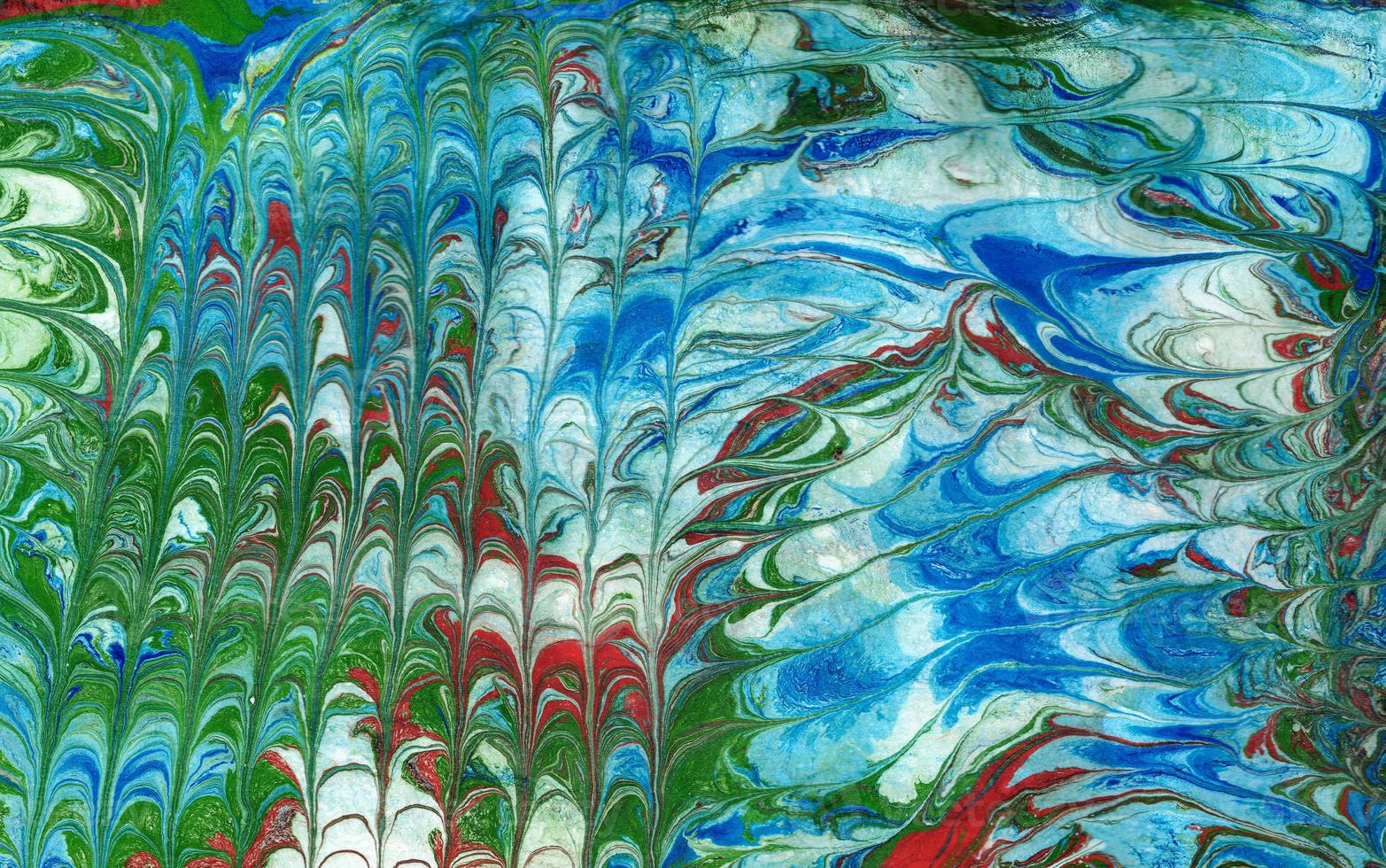 Abstract background of vivid blue and green color mixing with different tints creating uneven surface. Acrylic texture photo