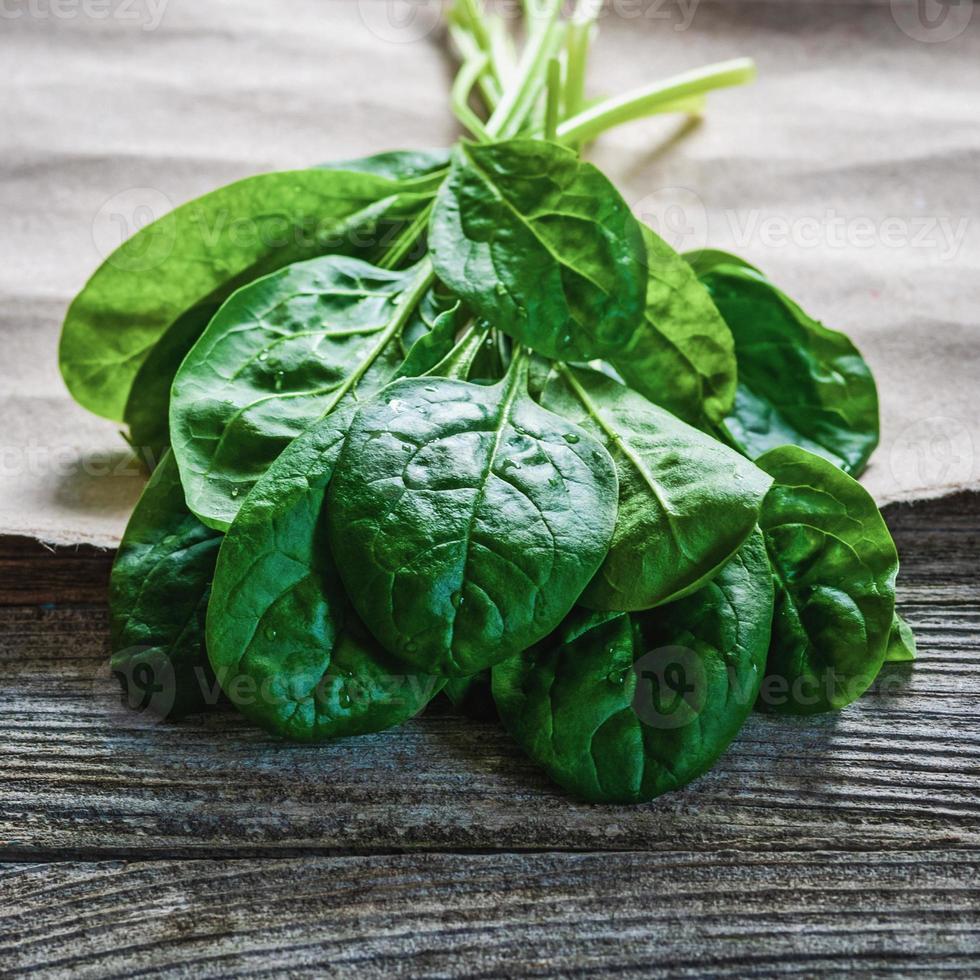 Spinach leaves on brown paper prepared for cooking 22457076 Stock Photo