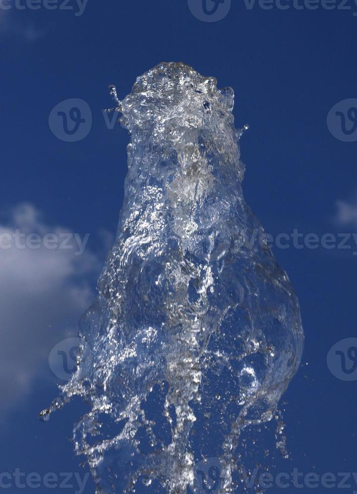 splashes of water over blue sky photo