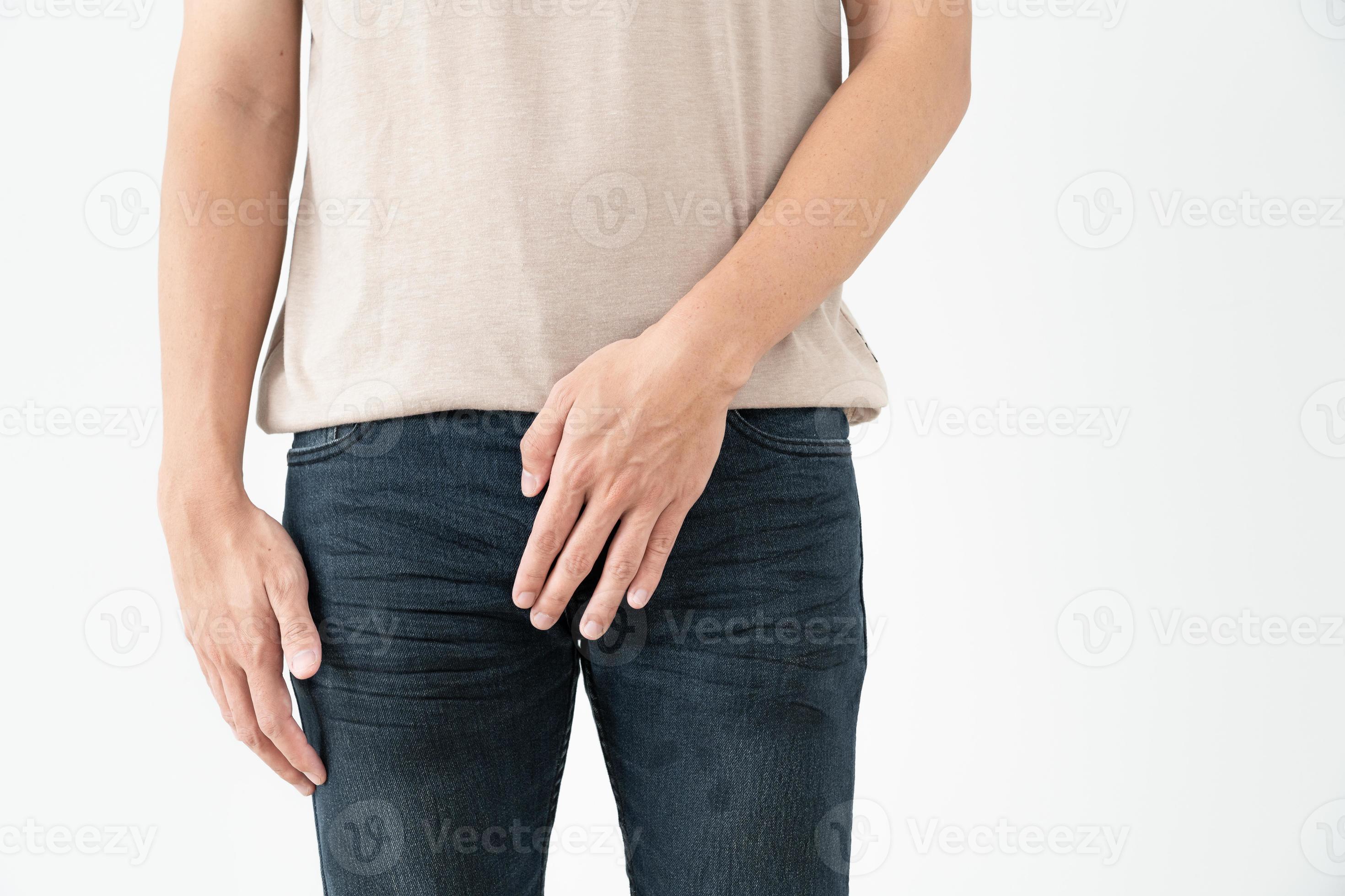 Man hold hand in front of private parts feeling from disease
