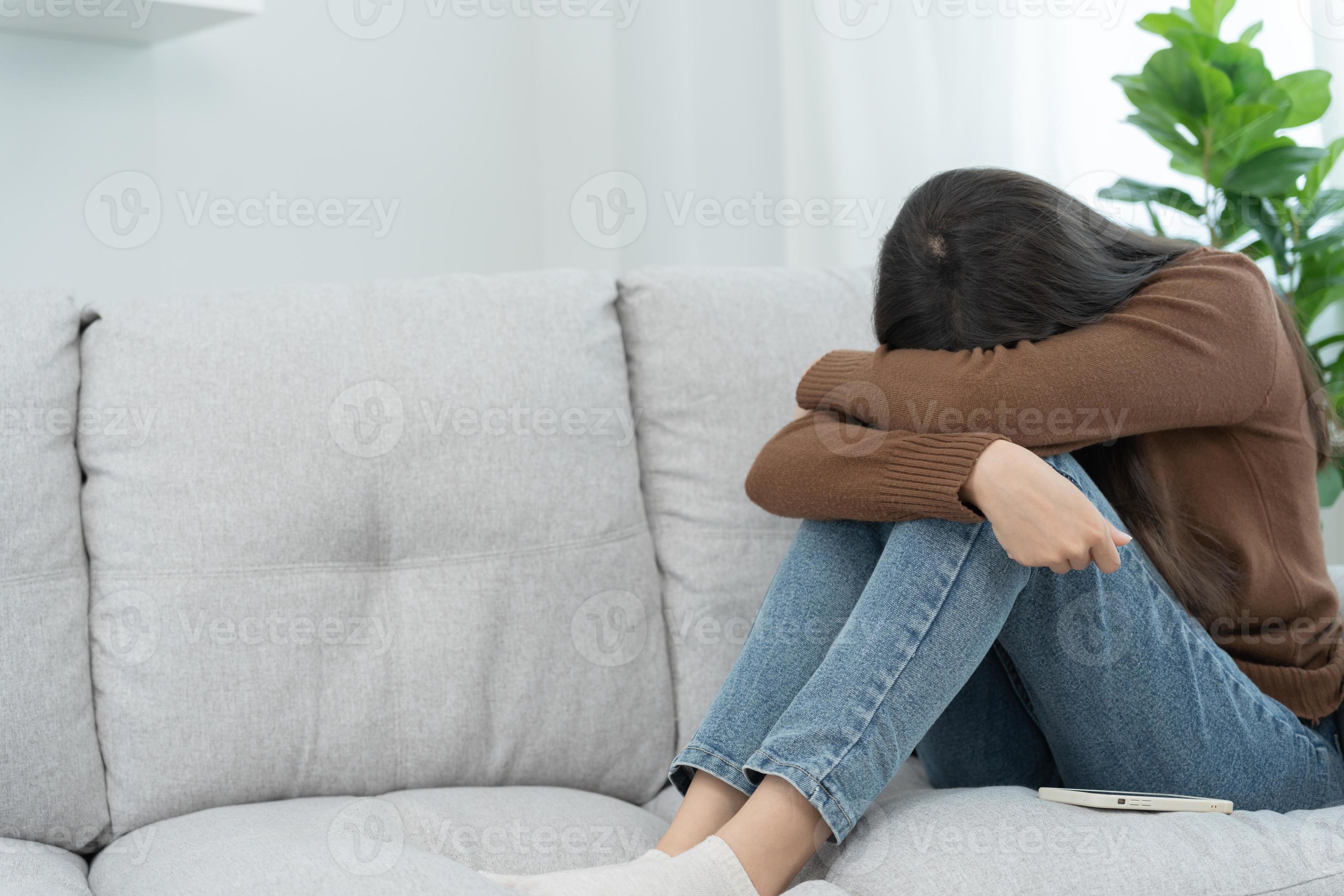 Unhappy asian woman girl disappointed, sad about problem in home alone