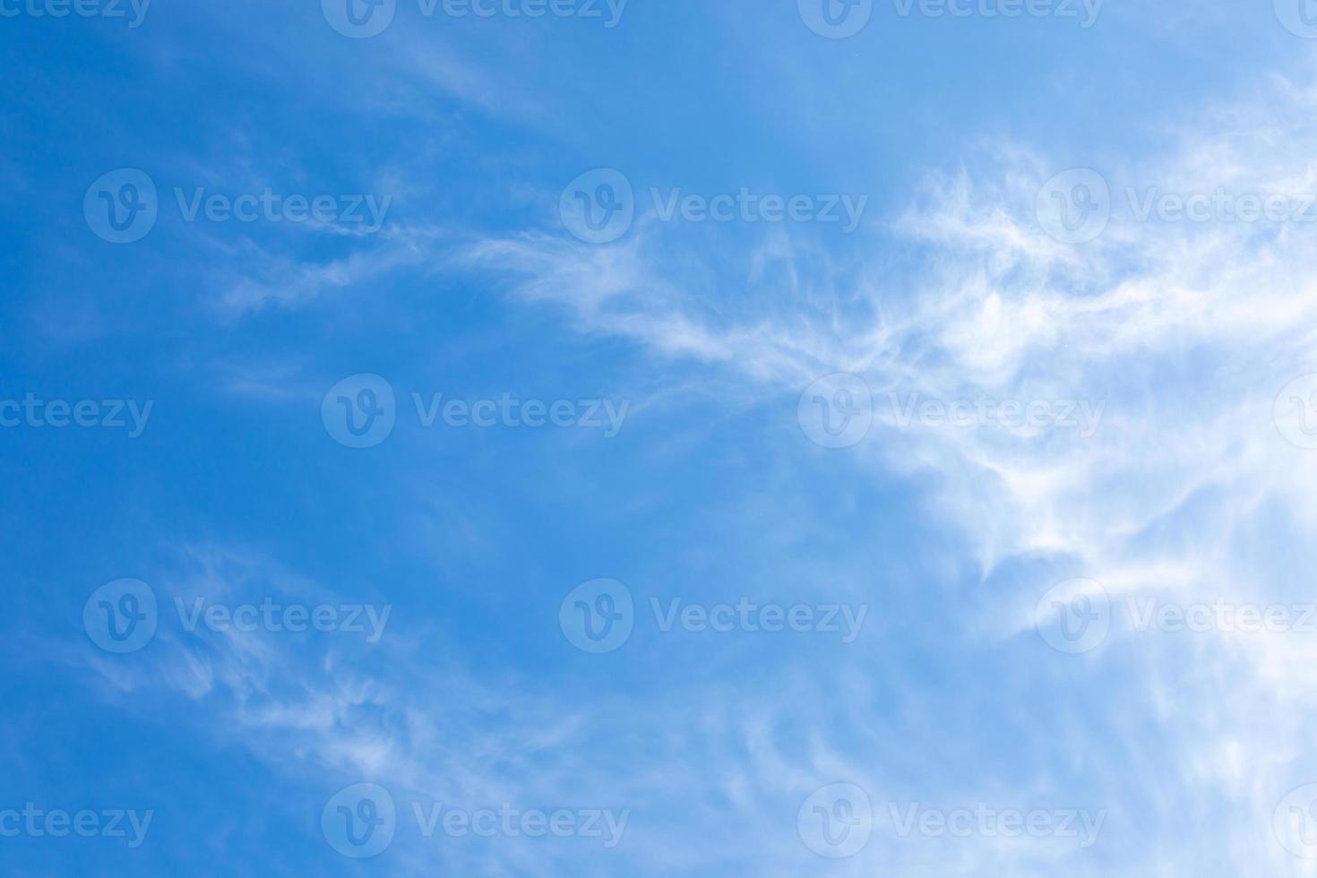 Natural white cirrus clouds on blue sky. Beauty of bright blue and white skyscape. photo