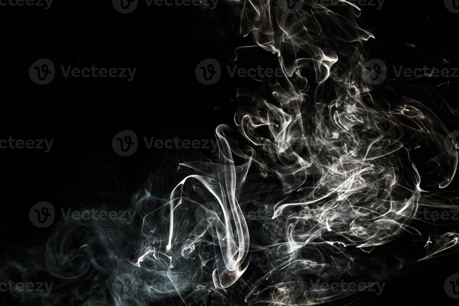 Smoke effect texture. Isolated background. Black and dark backdrop. Smokey fire and mistic effect. photo