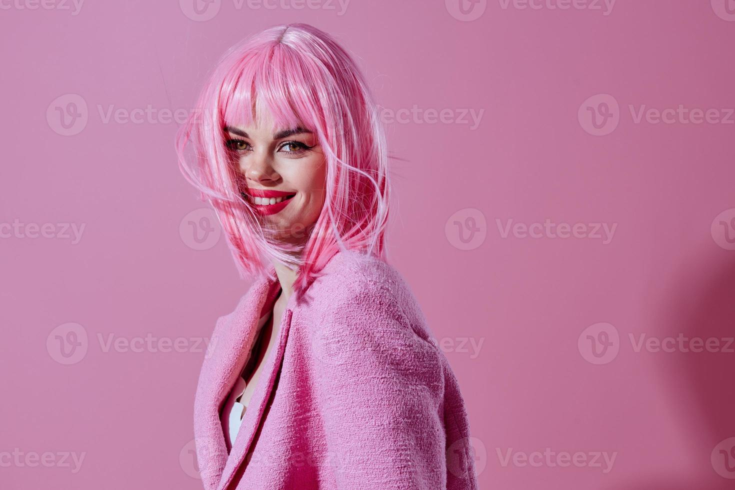 Young woman pink jacket holding hair cosmetics studio model unaltered photo
