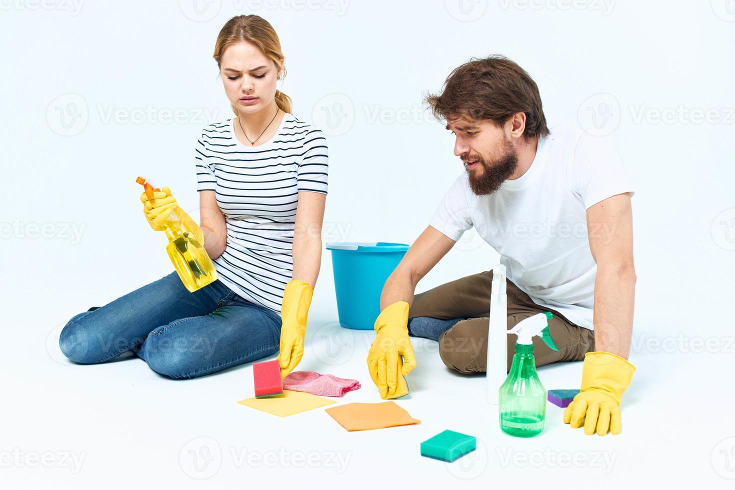 young couple washing floor service teamwork lifestyle chores photo