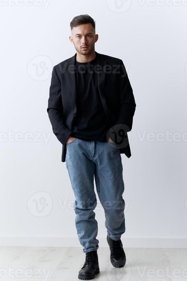 Modelling snapshots. Serious narcissistic self-confident attractive handsome man in classic suit jacket posing isolated in white studio background. Fashion offer. Copy space for ad. Full body shot photo