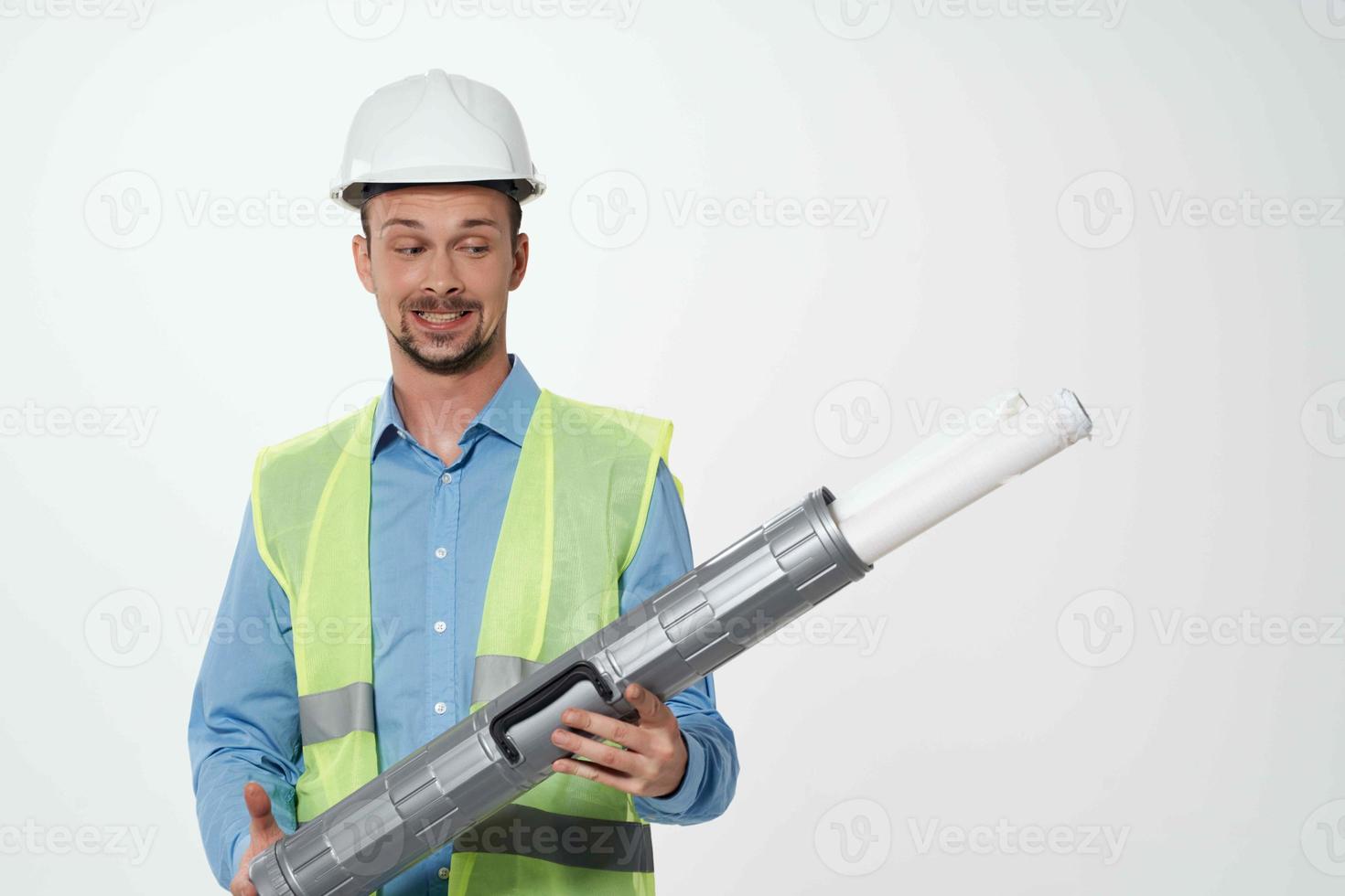 man reflective vest blueprints builder isolated background photo