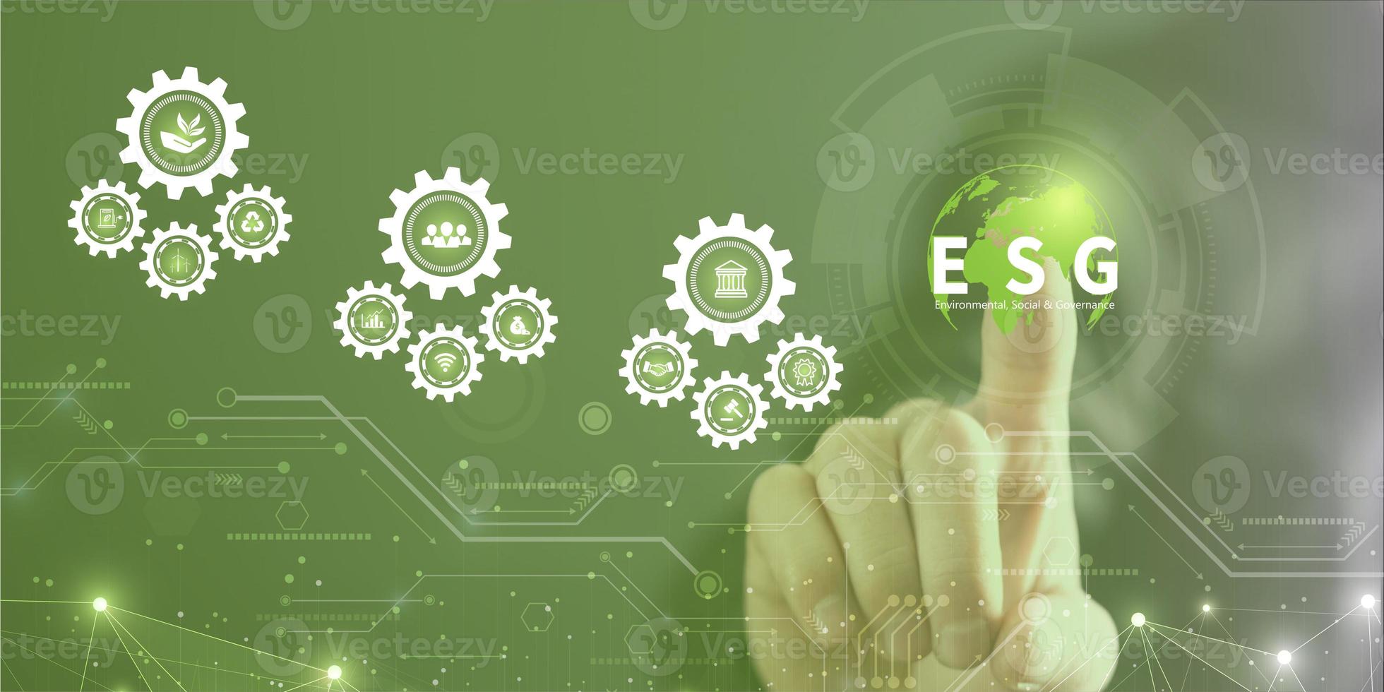 Businessman touching ESG icon on virtual screen for environmental, social, and governance in sustainable and ethical business on a technology green background photo