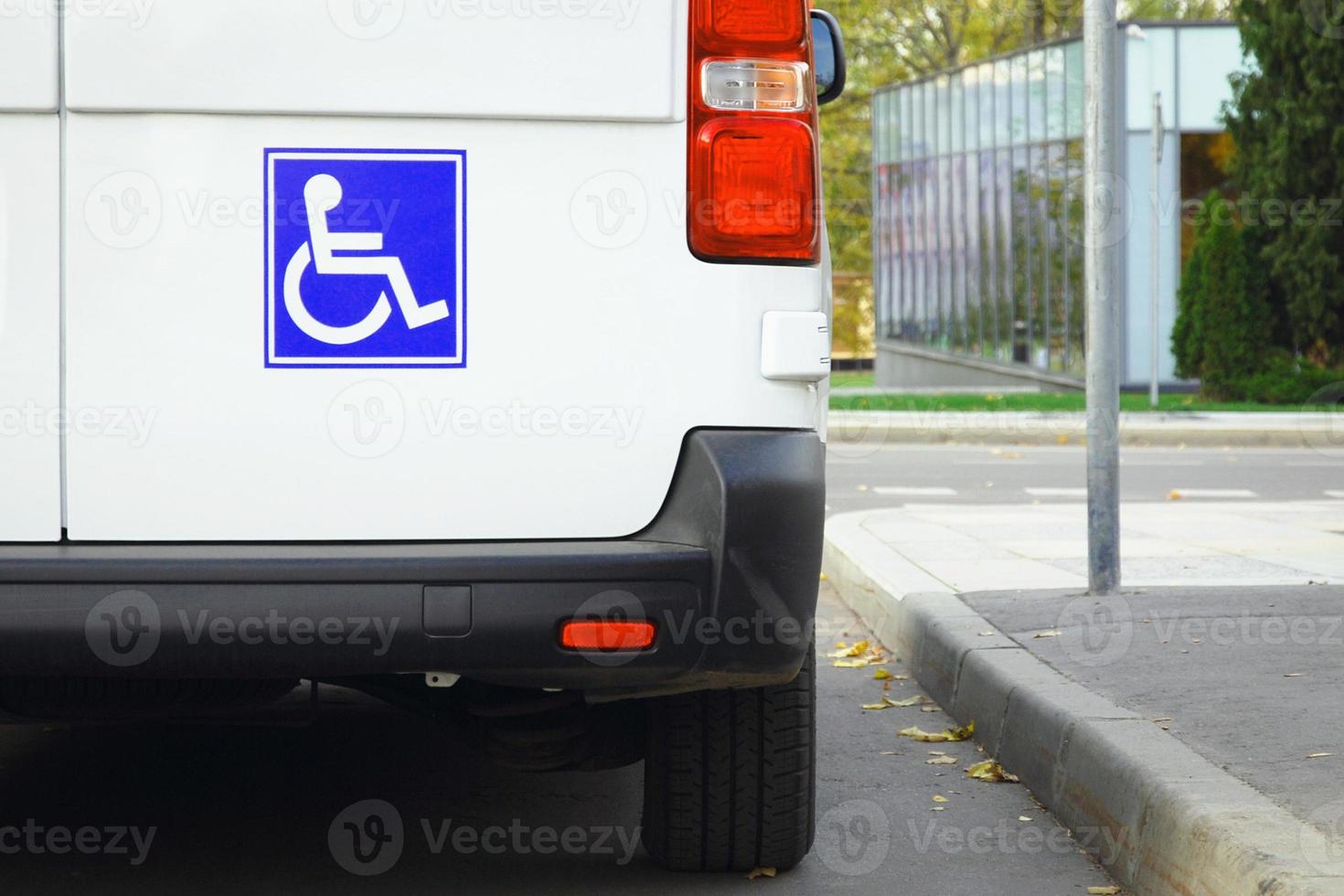 Disability sign on minivan back door, public transport accessibility photo