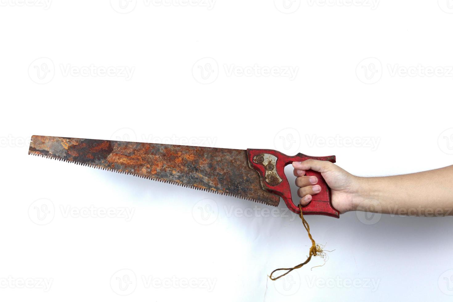 gloved hand holding saw isolated on white background photo