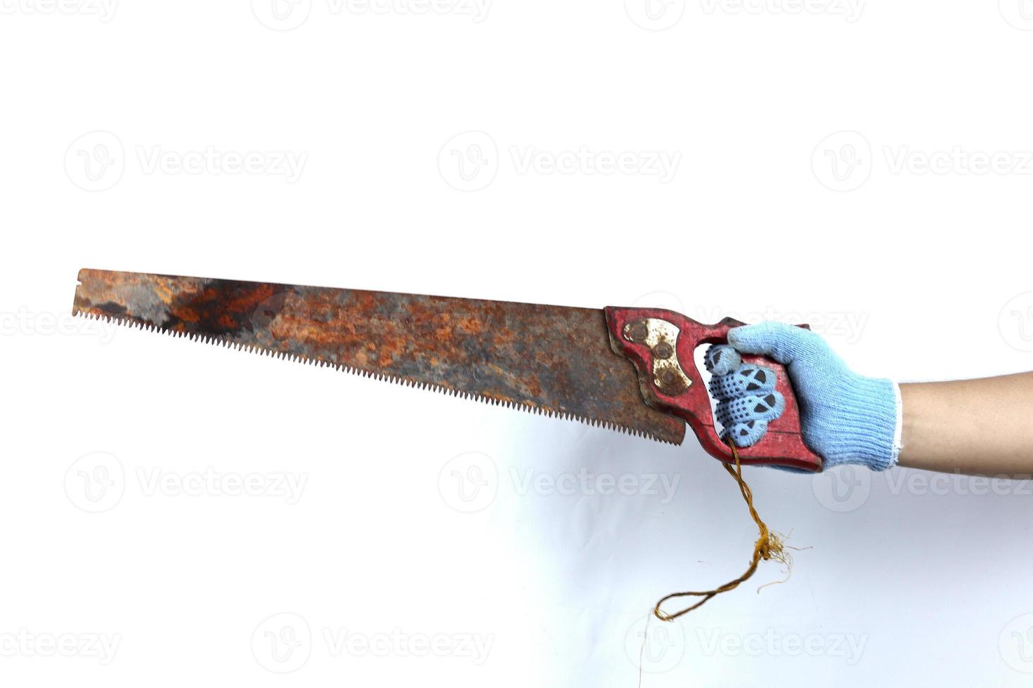 gloved hand holding saw isolated on white background photo