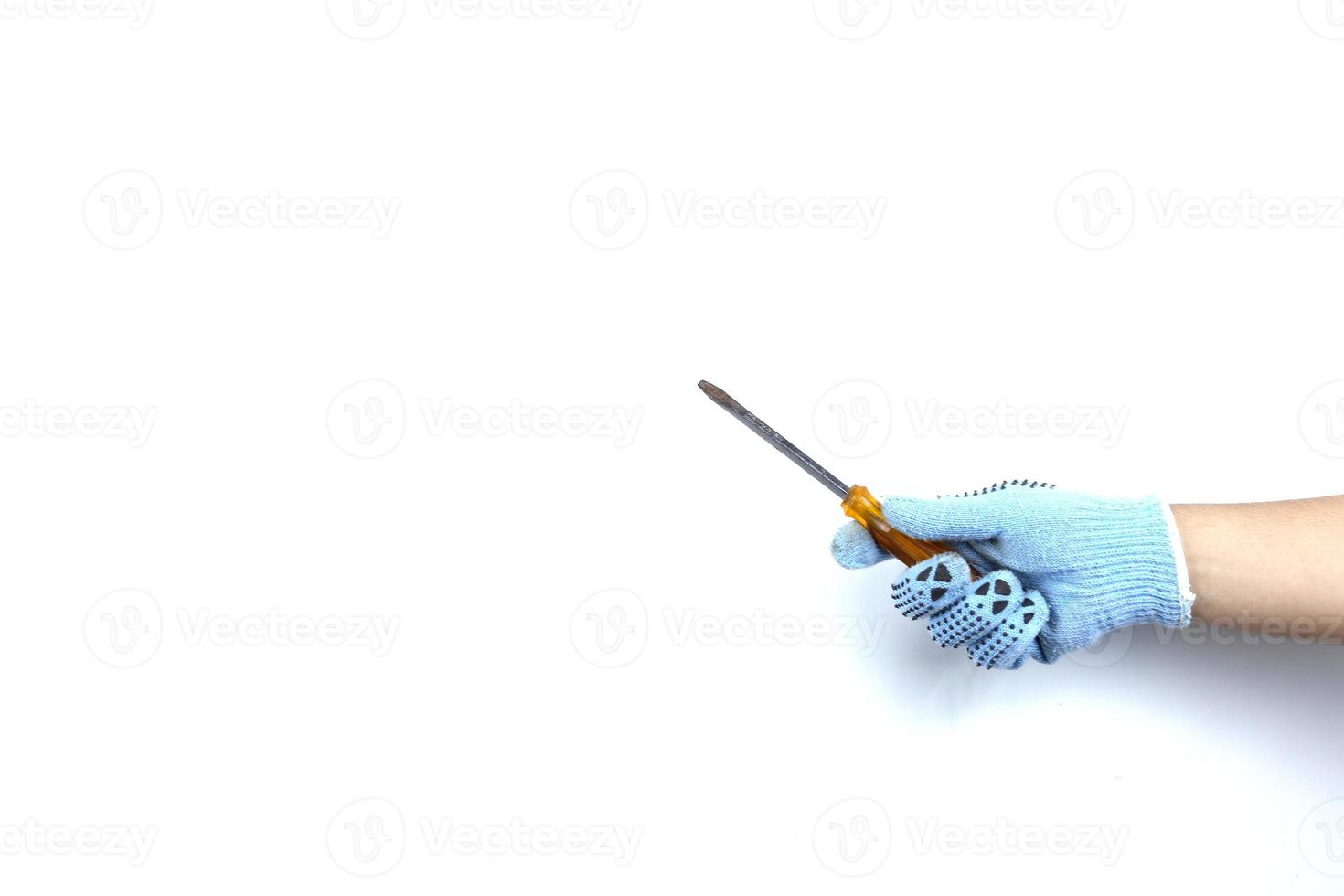 Gloved hand holding screwdriver isolated on white background photo