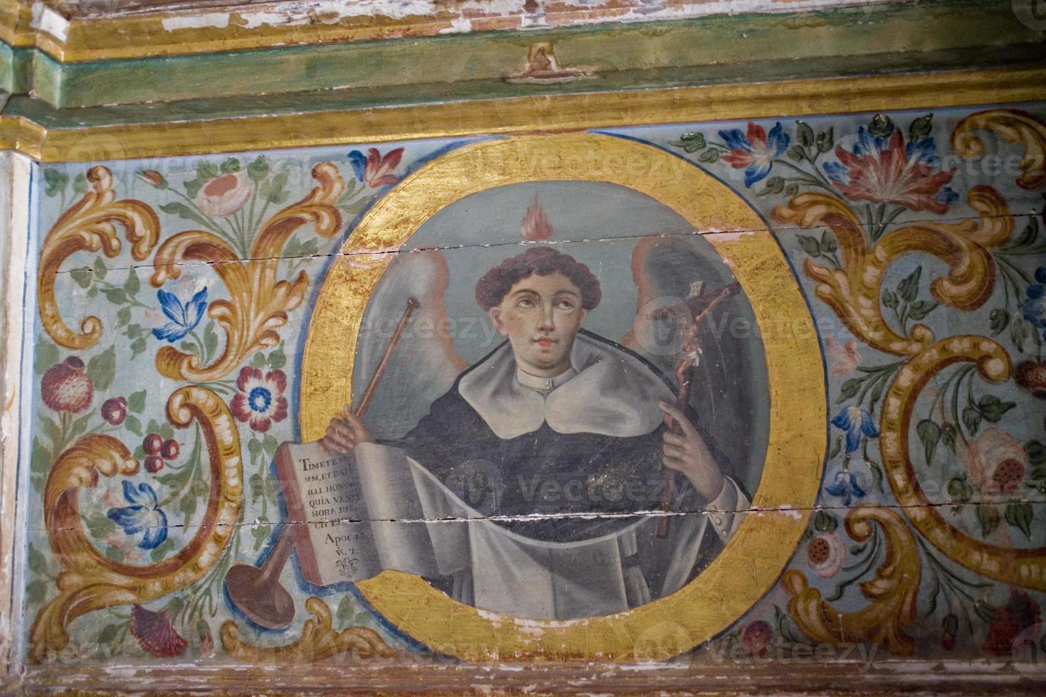 old painted details in a historic Spanish church creating an interesting background in close-up photo