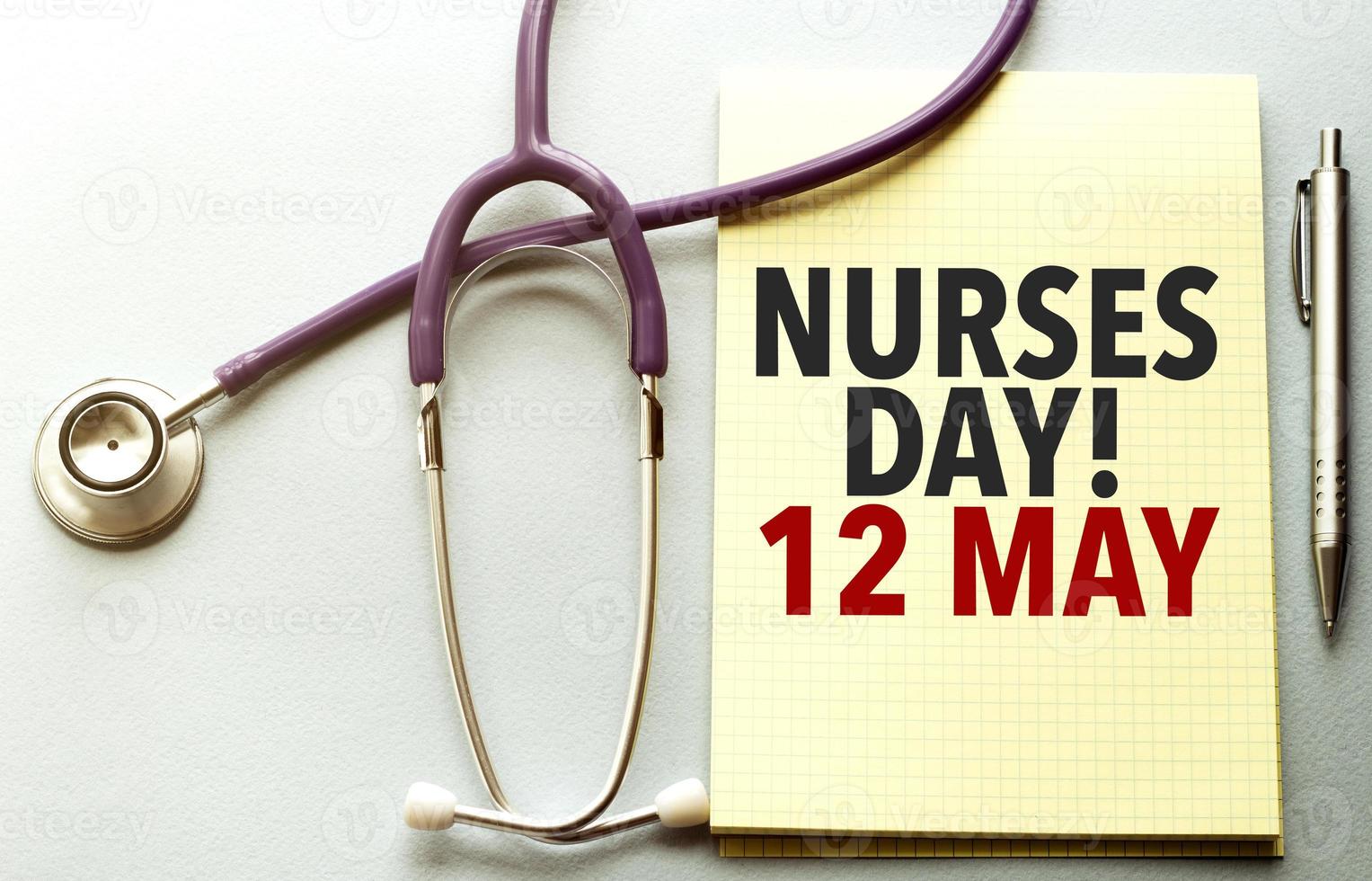 On a purple background a stethoscope with yellow list with text nurses day 12 may photo