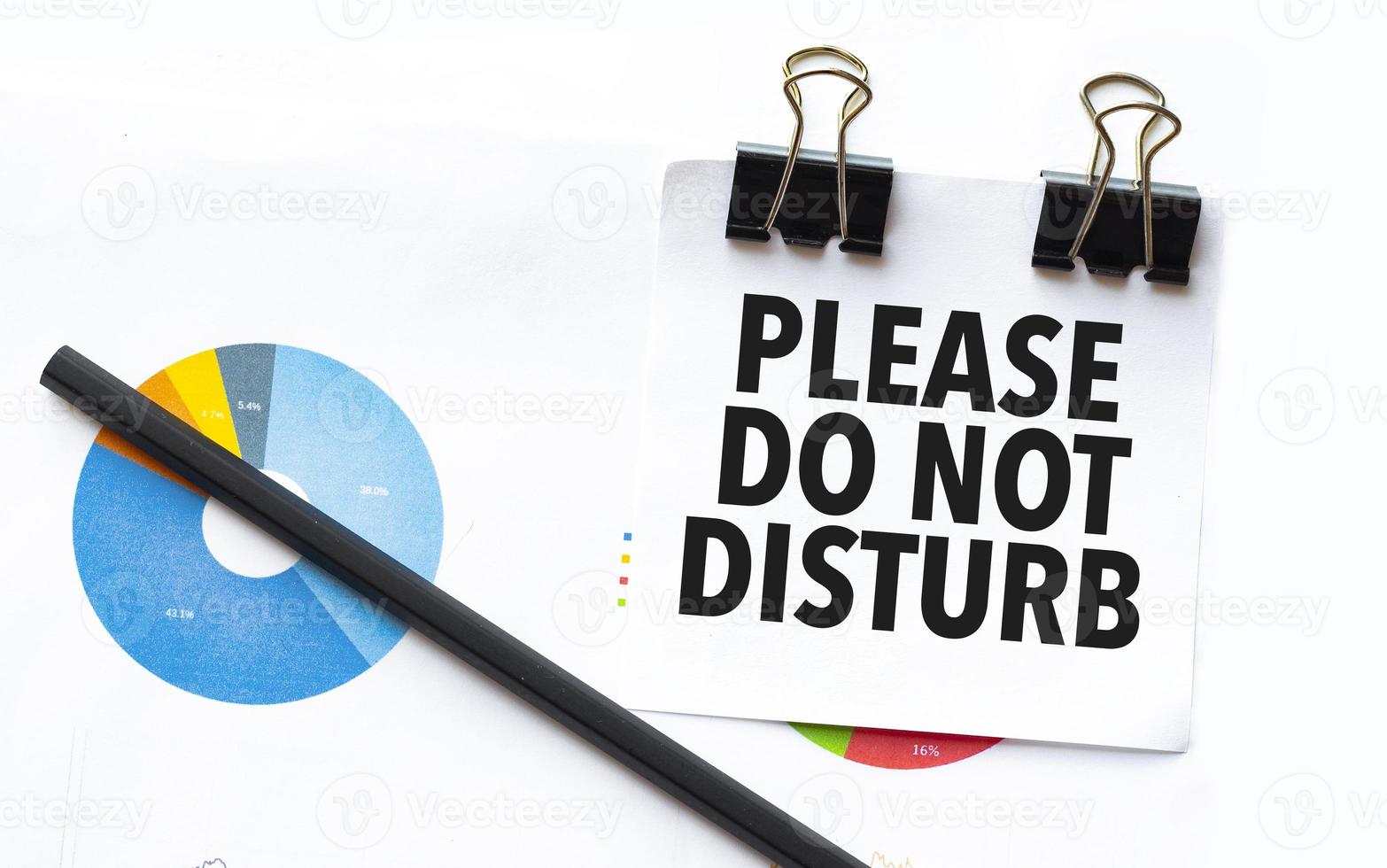 please do not disturb on notebook with charts and pencil photo