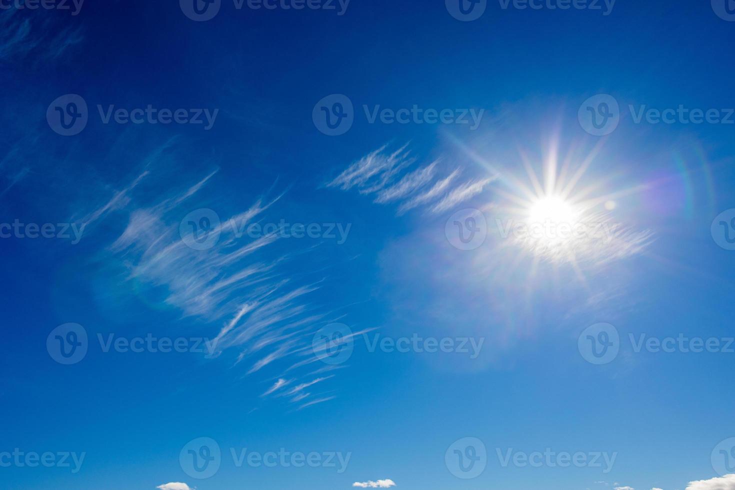 natural landscape background with blue sky, sun and white clouds photo