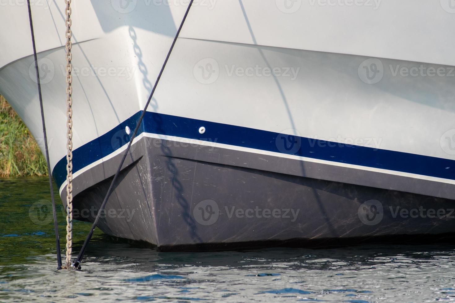 bow of a boat with anchor down photo