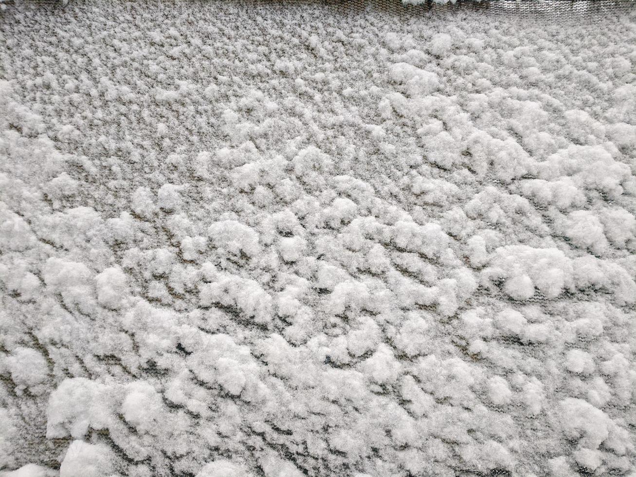 Texture of fresh snowy cloth Winter snow background photo