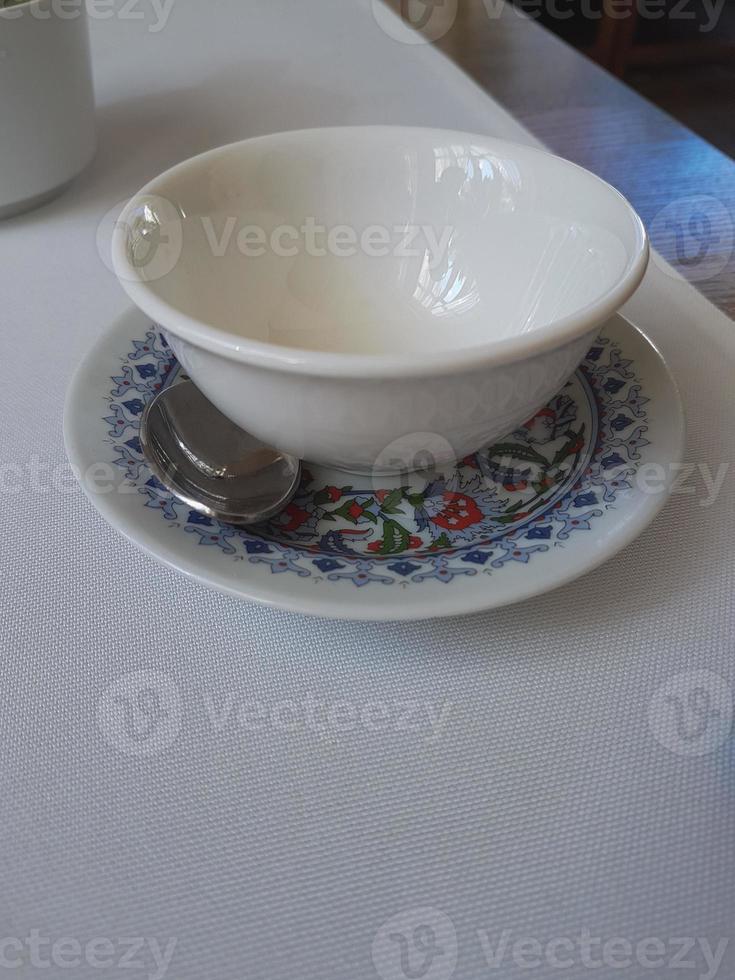 Two empty tea bowls in a restaurant photo