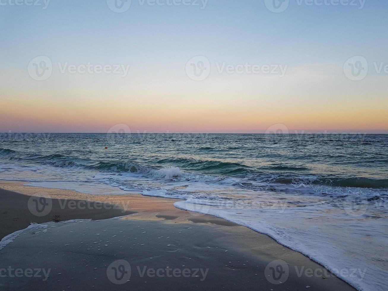 Seascape Sea with calm water and clear sky photo