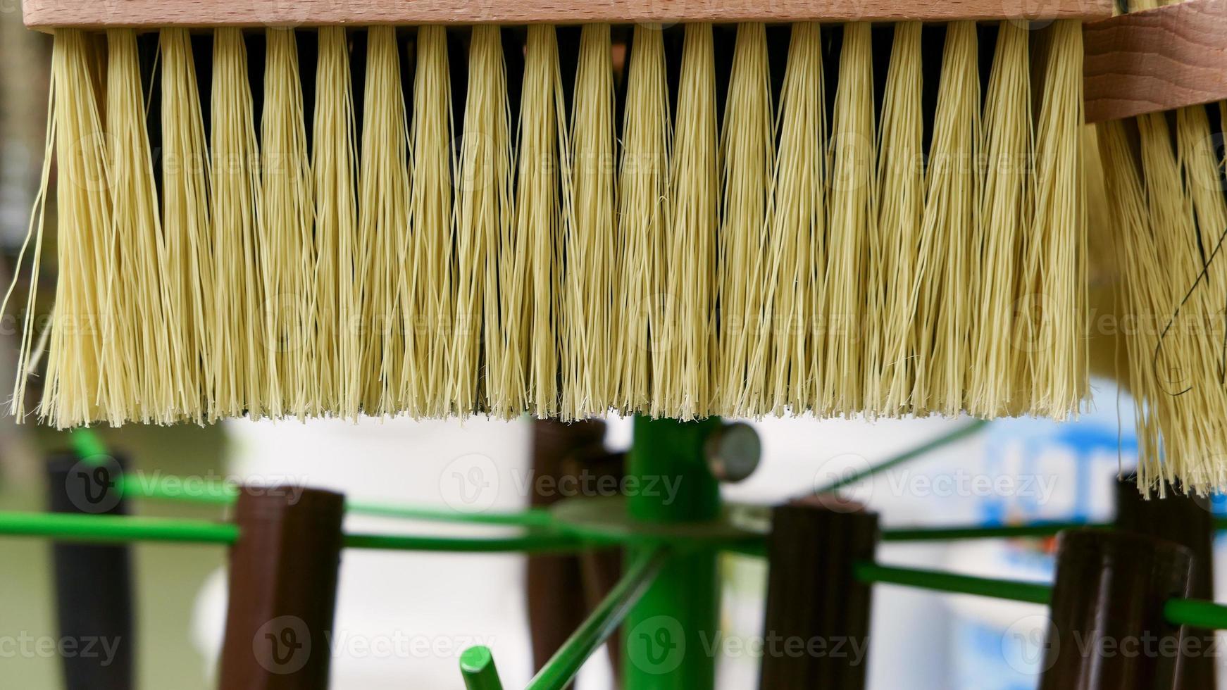 Rectangular wooden brush with synthetic bristles for painting and glue in the store photo