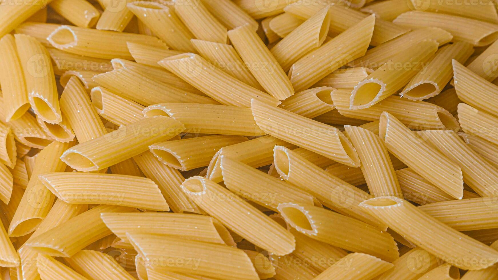 Dry Italian pasta background healthy food photo