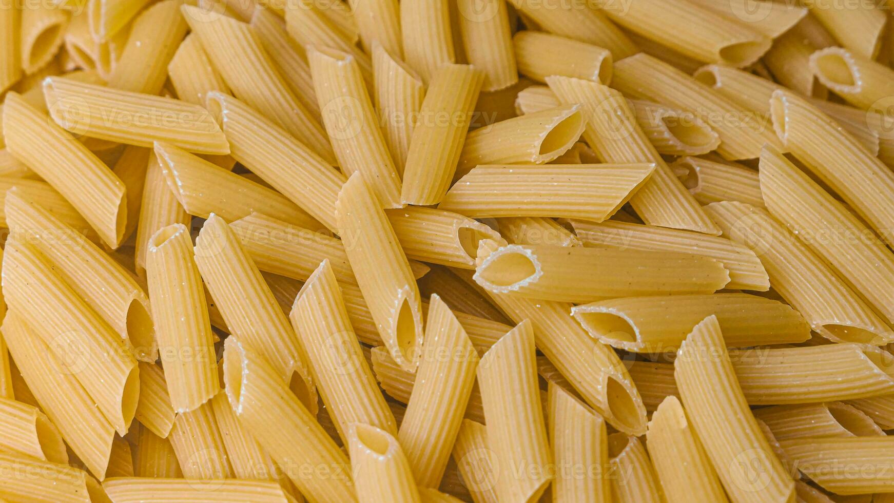 Dry Italian pasta background healthy food photo