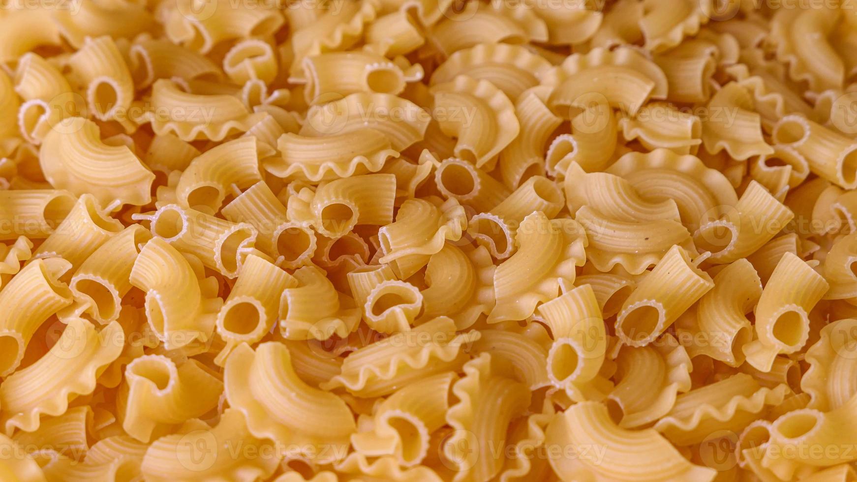 Dry Italian pasta background healthy food photo