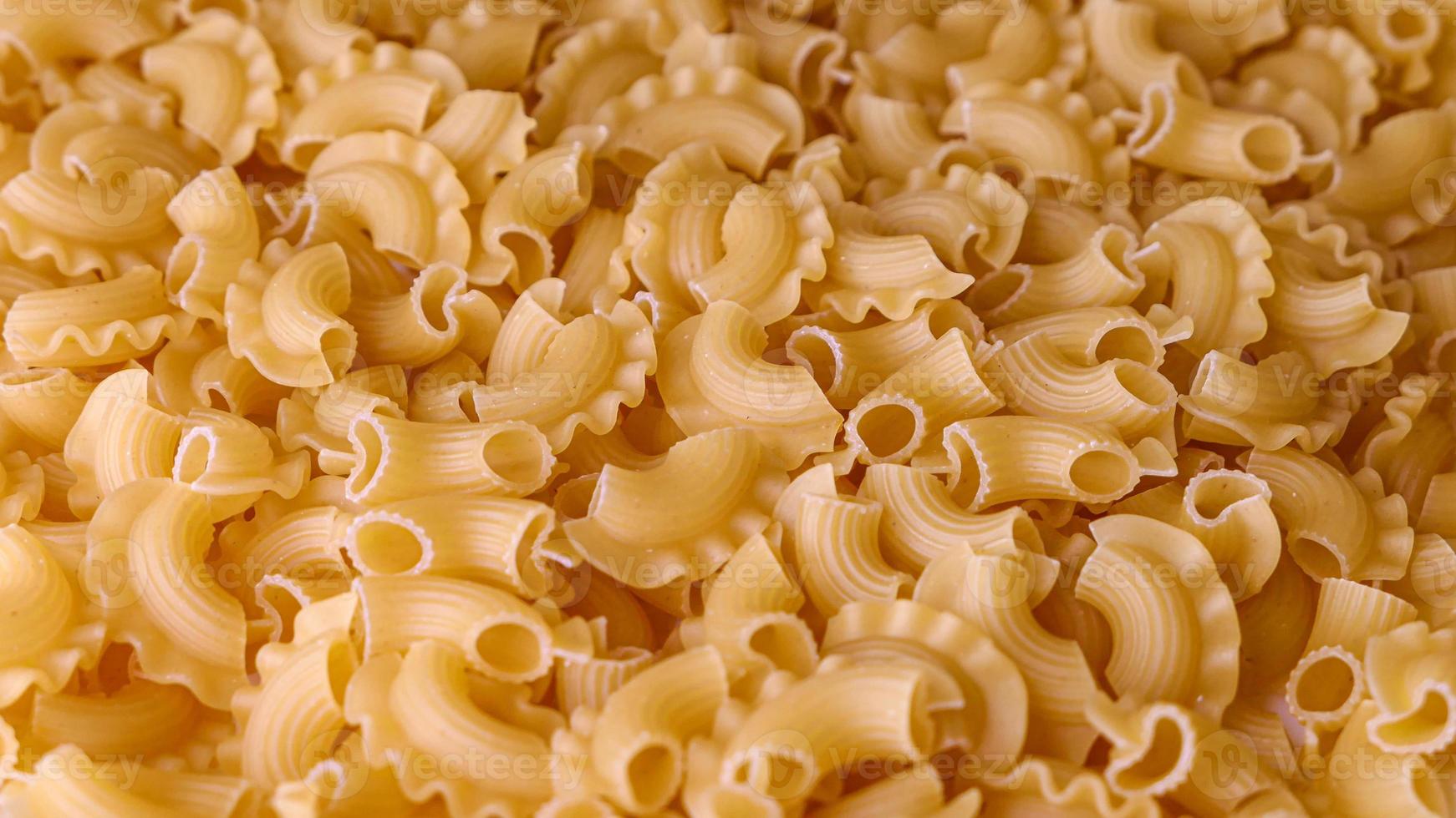 Dry Italian pasta background healthy food photo