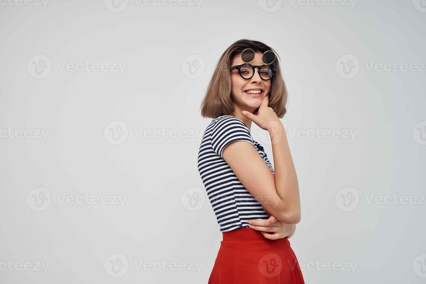 woman in striped t-shirt sunglasses studio isolated background photo