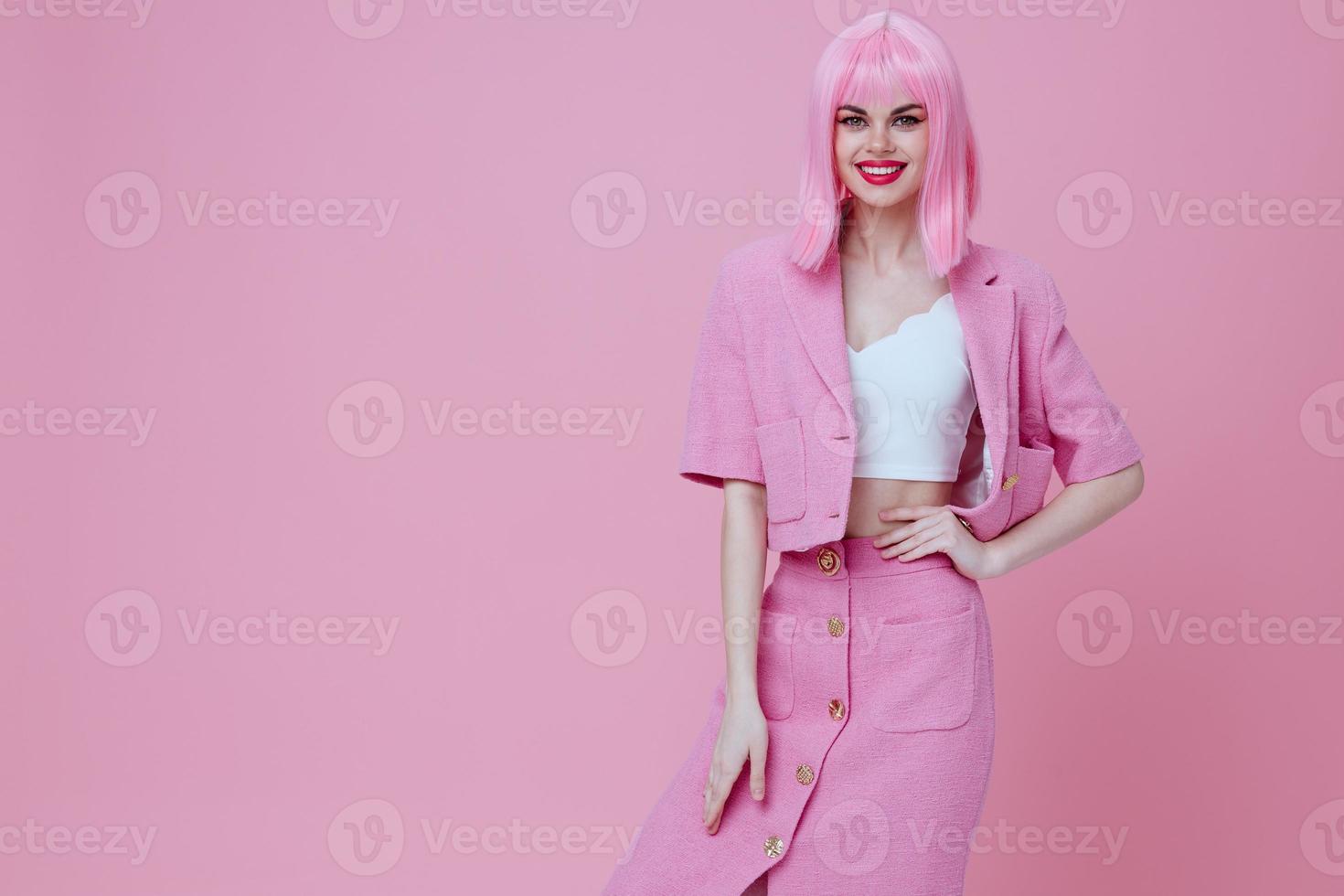 Beautiful fashionable girl bright makeup pink hair glamor pink background unaltered photo
