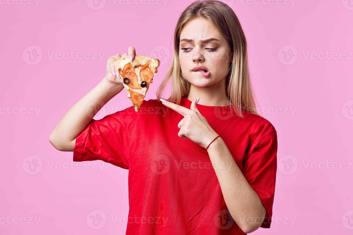 woman in red t-shirt snack fast food pink background photo