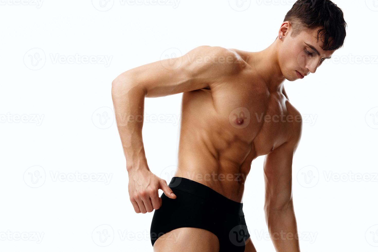 sporty male topless showing arm muscles and fitness bodybuilder model underpants photo