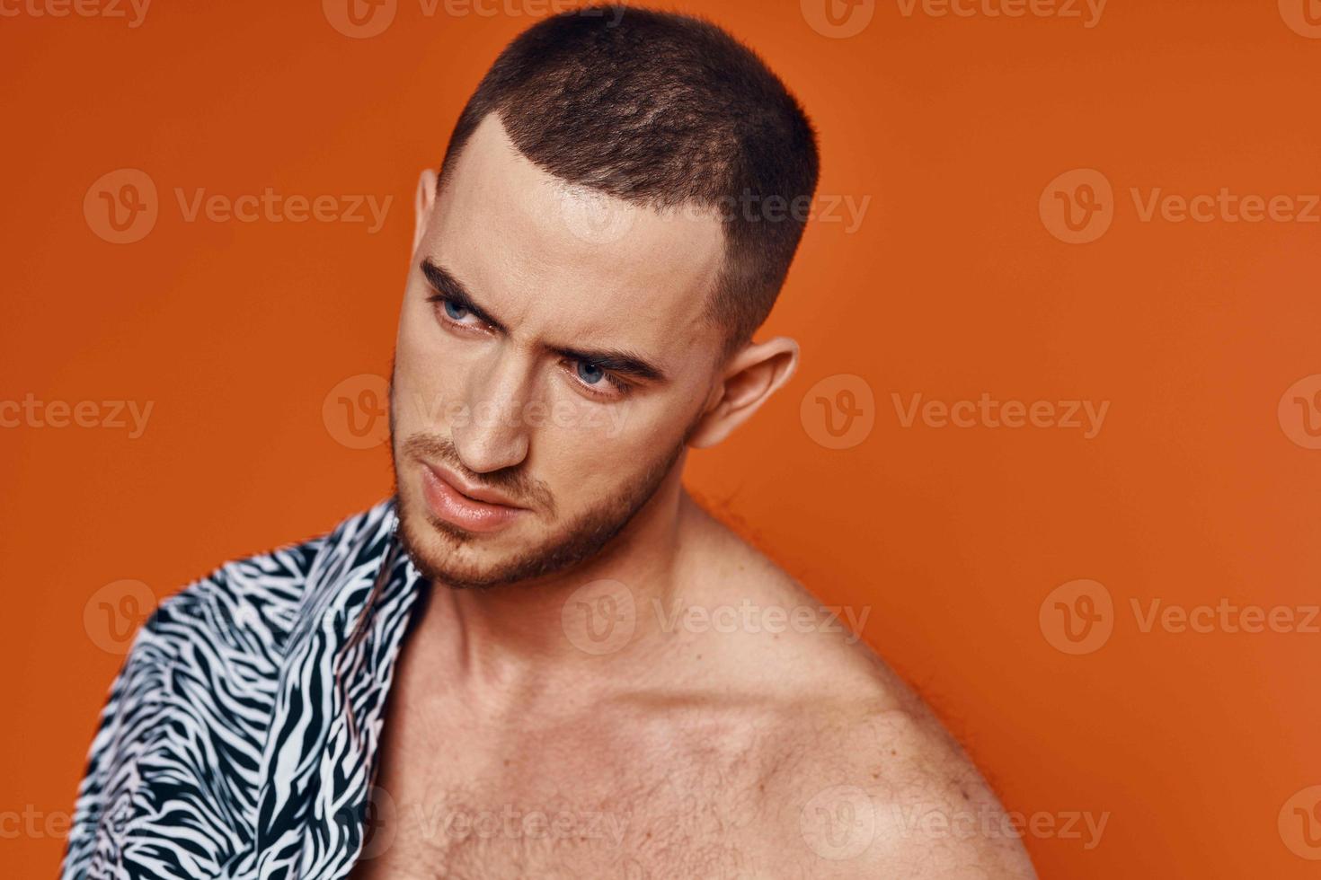 handsome man in shirt nude torso posing fashion orange background photo