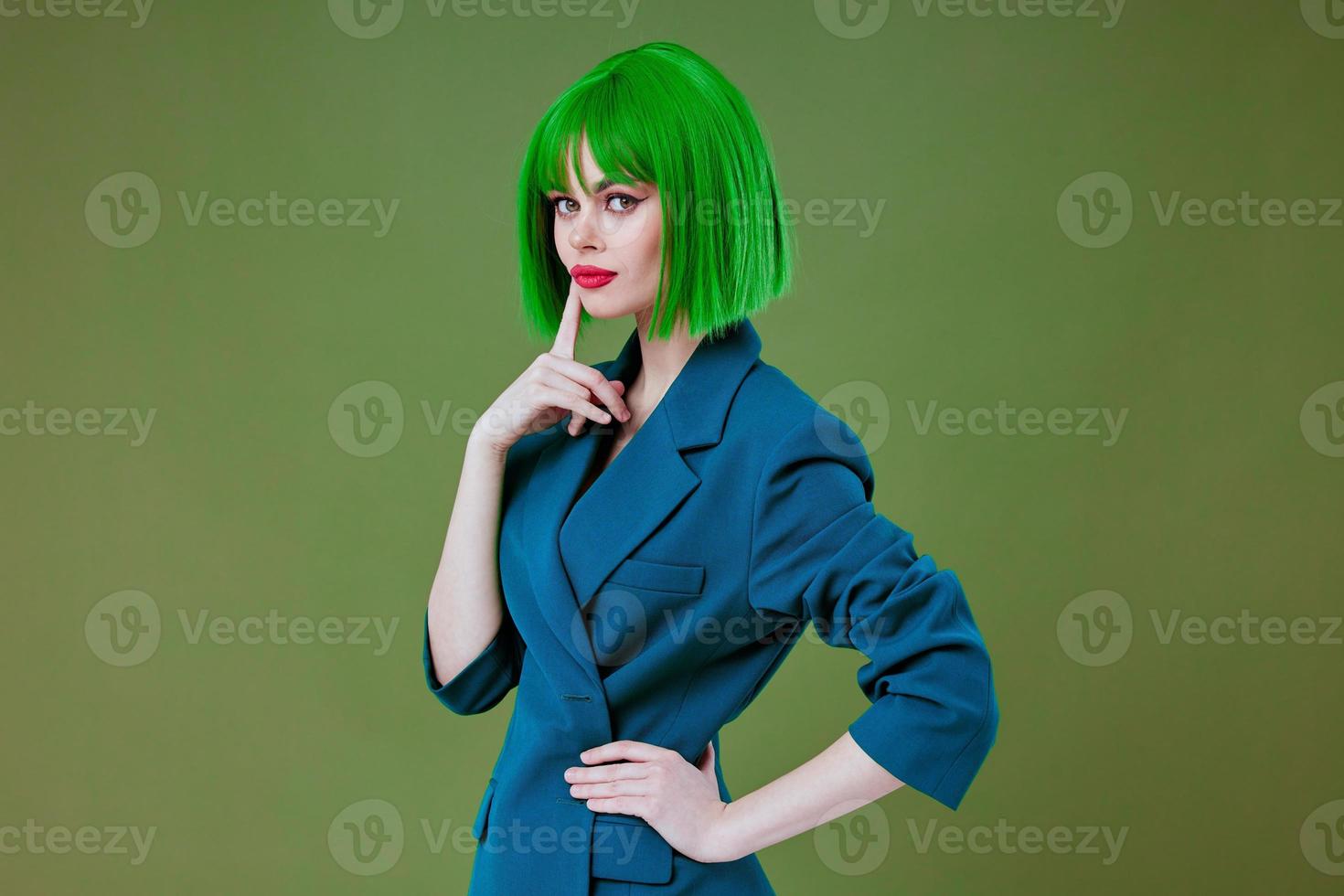 Beautiful fashionable girl fun gesture hands green hair fashion studio model unaltered photo