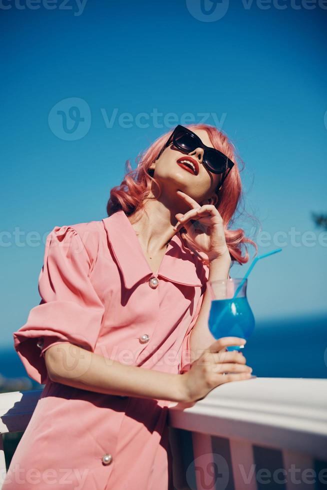 Delighted young girl pink hair sunglasses leisure luxury vintage Summer day photo