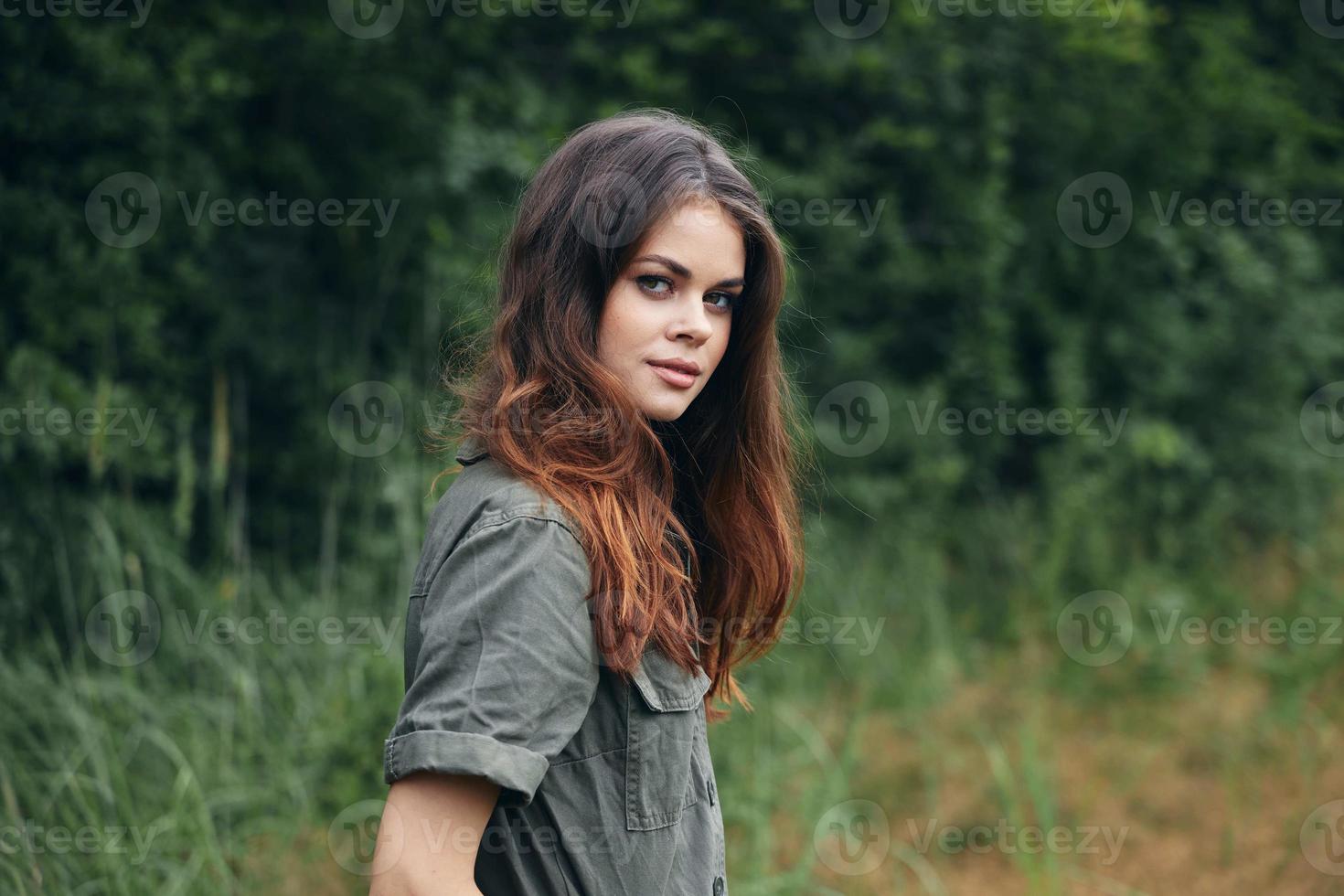 Woman in the forest Attractive view nature fresh air green leaves travel photo