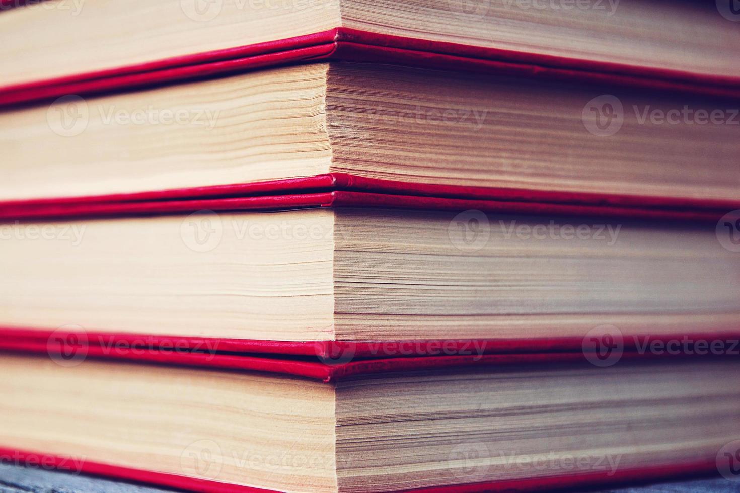 Stack of old books in red hardcovers photo
